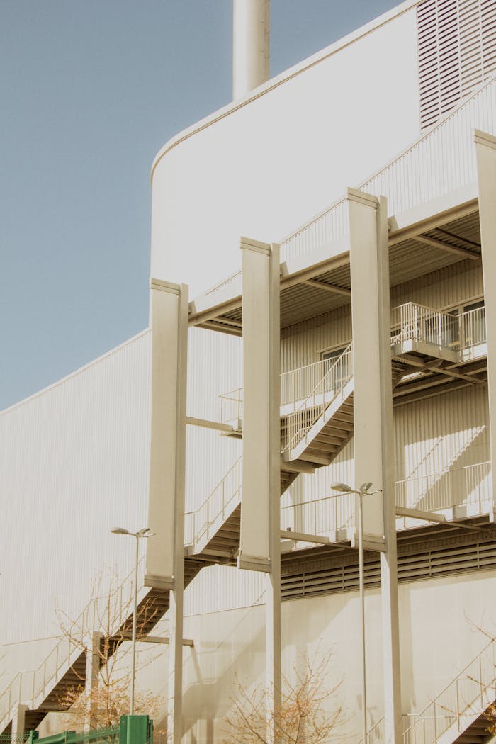 Modern industrial building with prominent exterior staircase in Shrewsbury, England.